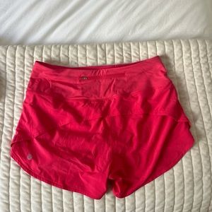 Size 8 lululemon High Rise 4 inch inseam Speed Up shorts in color Lip Gloss